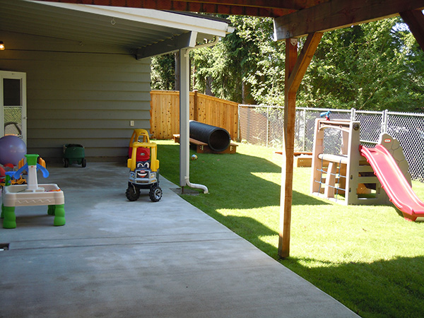 Outdoor play area includes covered space
